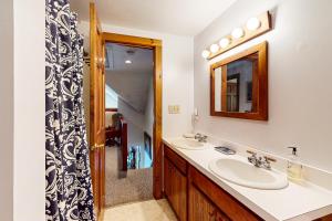 a bathroom with two sinks and a mirror at Moose & Red Fox Retreat in Denmark +200 photos
