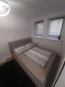 Postel nebo postele na pokoji v ubytování Centrum Koszalina -Stylowe mieszkanie na doby