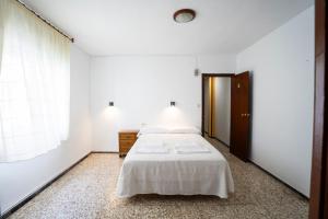 Postel nebo postele na pokoji v ubytování Hostal Residencia Pasaje