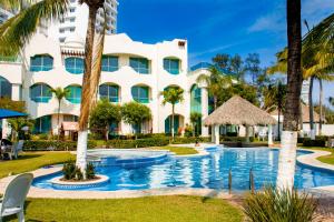 Bazén v ubytování Playa Caracol Hotel & Spa nebo v jeho okolí