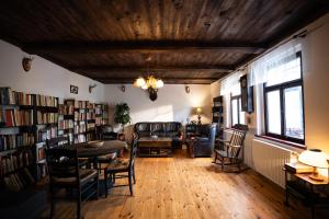 a living room with a couch and a table and chairs at Barinka in Světec