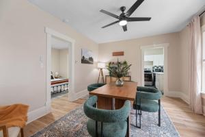 a living room with a dining room table and chairs at Beautiful 2 Bed 1 Bath home near College Hill in Wichita