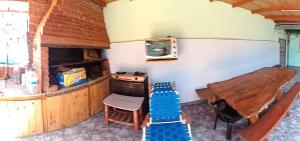 a room with a counter and a table and chairs at jazmin apart iguazu in Puerto Iguazú