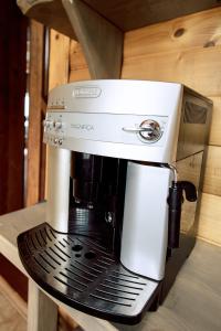 a coffee maker sitting on top of a shelf at Mountain Cottage in Yaremche