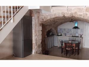 Η κουζίνα ή μικρή κουζίνα στο B&B Lo Scrigno della Taranta