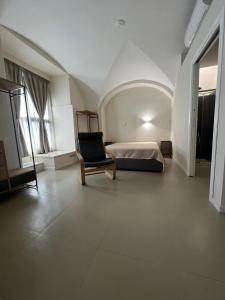 En eller flere senge i et værelse på Ursino house