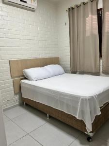 Postel nebo postele na pokoji v ubytování Chalé em Barreirinhas
