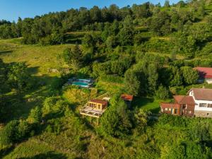 an aerial view of a house on a hill at Home - Retour aux sources in Le Ménil
