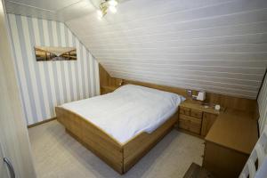 Postel nebo postele na pokoji v ubytování Haus Leysand - Ostfriesische Gemütlichkeit