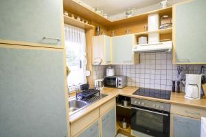 Kuchyň nebo kuchyňský kout v ubytování Haus Leysand - Ostfriesische Gemütlichkeit