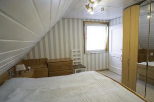 Postel nebo postele na pokoji v ubytování Haus Leysand - Ostfriesische Gemütlichkeit