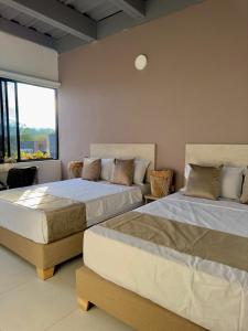 Postel nebo postele na pokoji v ubytování Hotel Med Llanogrande