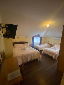 Postel nebo postele na pokoji v ubytování Hotel Küyen-Ko Pucón