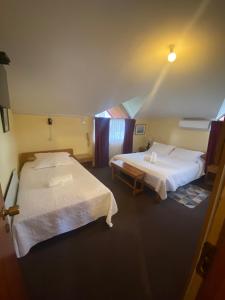 Postel nebo postele na pokoji v ubytování Hotel Küyen-Ko Pucón