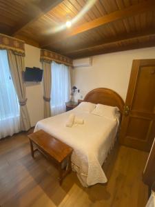 Postel nebo postele na pokoji v ubytování Hotel Küyen-Ko Pucón