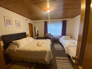 Postel nebo postele na pokoji v ubytování Hotel Küyen-Ko Pucón