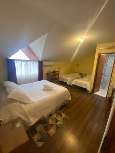 Postel nebo postele na pokoji v ubytování Hotel Küyen-Ko Pucón