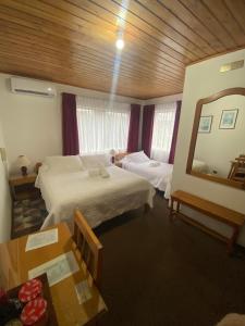 Postel nebo postele na pokoji v ubytování Hotel Küyen-Ko Pucón