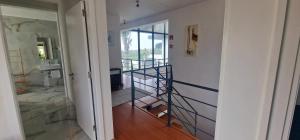 a bathroom with a staircase in a room with a sink at Exceptional villa in Vila Franca Do Campo with private pool in Vila Franca do Campo +17 photos