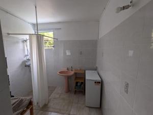 a bathroom with a sink and a toilet and a shower at Maison F4 à Sainte - Anne, Guadeloupe in Sainte-Anne +8 photos
