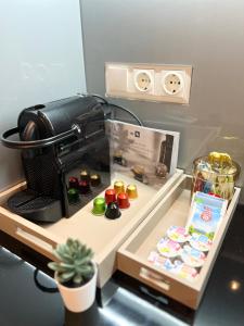 a camera sitting on a table with some food at Vienna Charm Apartments Meidling in Vienna