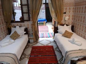 Postel nebo postele na pokoji v ubytování Dar Margot Marrakech + 37 fotografií