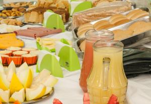 a table topped with lots of different types of food at Hotel Transbrasil in Belém