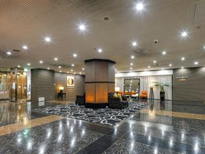 a lobby of a hotel with a large lobby at APA Hotel Nagoya Sakae Ekimae EXCELLENT in Nagoya +34 photos