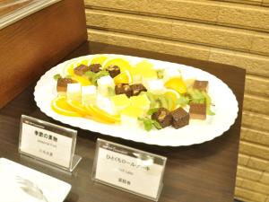 a plate of food sitting on top of a table at APA Hotel Nagoya Sakae Ekimae EXCELLENT in Nagoya
