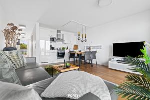 a living room with a couch and a table at Ferienwohnung Harbour Side, App 7 Olpenitz in Olpenitz