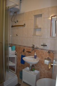Kúpeľňa v ubytovaní Apartments by the sea Seget Vranjica, Trogir - 7509 + 10 fotografií