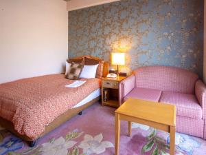 Postel nebo postele na pokoji v ubytování Hotel Villa Kuretake