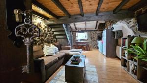 a living room with a couch and a table at Cobijo de Villar in Carrocera