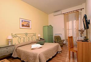 Postel nebo postele na pokoji v ubytování Hotel Alexander & Spa