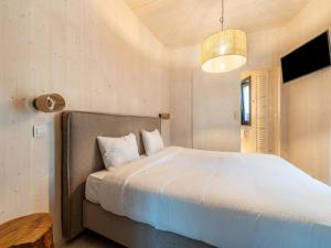 a bedroom with a large bed and a table at Serene Retreat in Antoing in Antoing