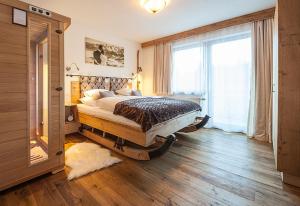 Postel nebo postele na pokoji v ubytování Alpineas