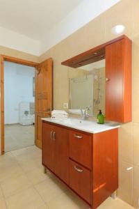 a bathroom with a sink and a mirror at Domik by the sea in Haifa +25 photos