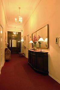 a hallway with a large mirror on the wall at Hotel Alexander & Spa in Sanremo