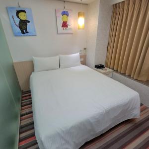 Ένα ή περισσότερα κρεβάτια σε δωμάτιο στο Morwing Hotel Fuzhong