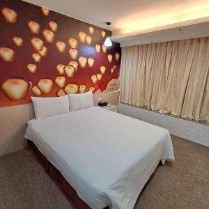 Ένα ή περισσότερα κρεβάτια σε δωμάτιο στο Morwing Hotel Fuzhong