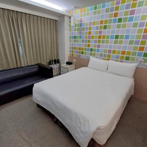 Ένα ή περισσότερα κρεβάτια σε δωμάτιο στο Morwing Hotel Fuzhong