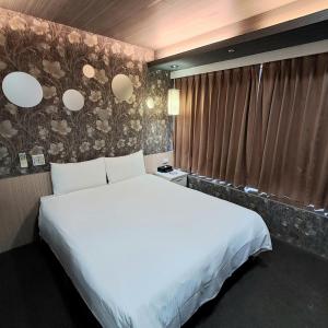 Ένα ή περισσότερα κρεβάτια σε δωμάτιο στο Morwing Hotel Fuzhong