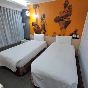 Ένα ή περισσότερα κρεβάτια σε δωμάτιο στο Morwing Hotel Fuzhong