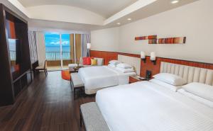 Postel nebo postele na pokoji v ubytování Hyatt Regency Guam