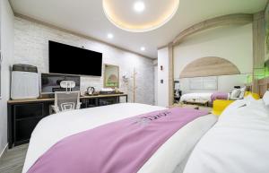 Postel nebo postele na pokoji v ubytování Soop Hotel