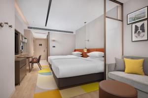 Ένα ή περισσότερα κρεβάτια σε δωμάτιο στο Home2 Suite by Hilton Hengyang Xidu