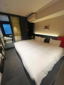 Postel nebo postele na pokoji v ubytování Nplus HOTEL Higashikanda-akihabara