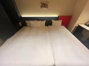 Postel nebo postele na pokoji v ubytování Nplus HOTEL Higashikanda-akihabara
