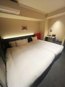 Postel nebo postele na pokoji v ubytování Nplus HOTEL Higashikanda-akihabara