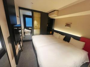 Postel nebo postele na pokoji v ubytování Nplus HOTEL Higashikanda-akihabara